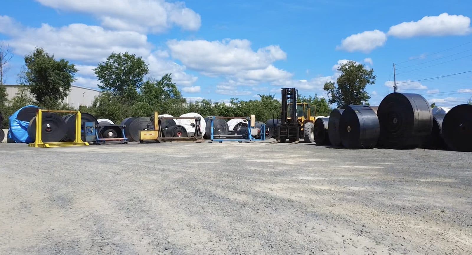 Conveyor belt rolls in the yard